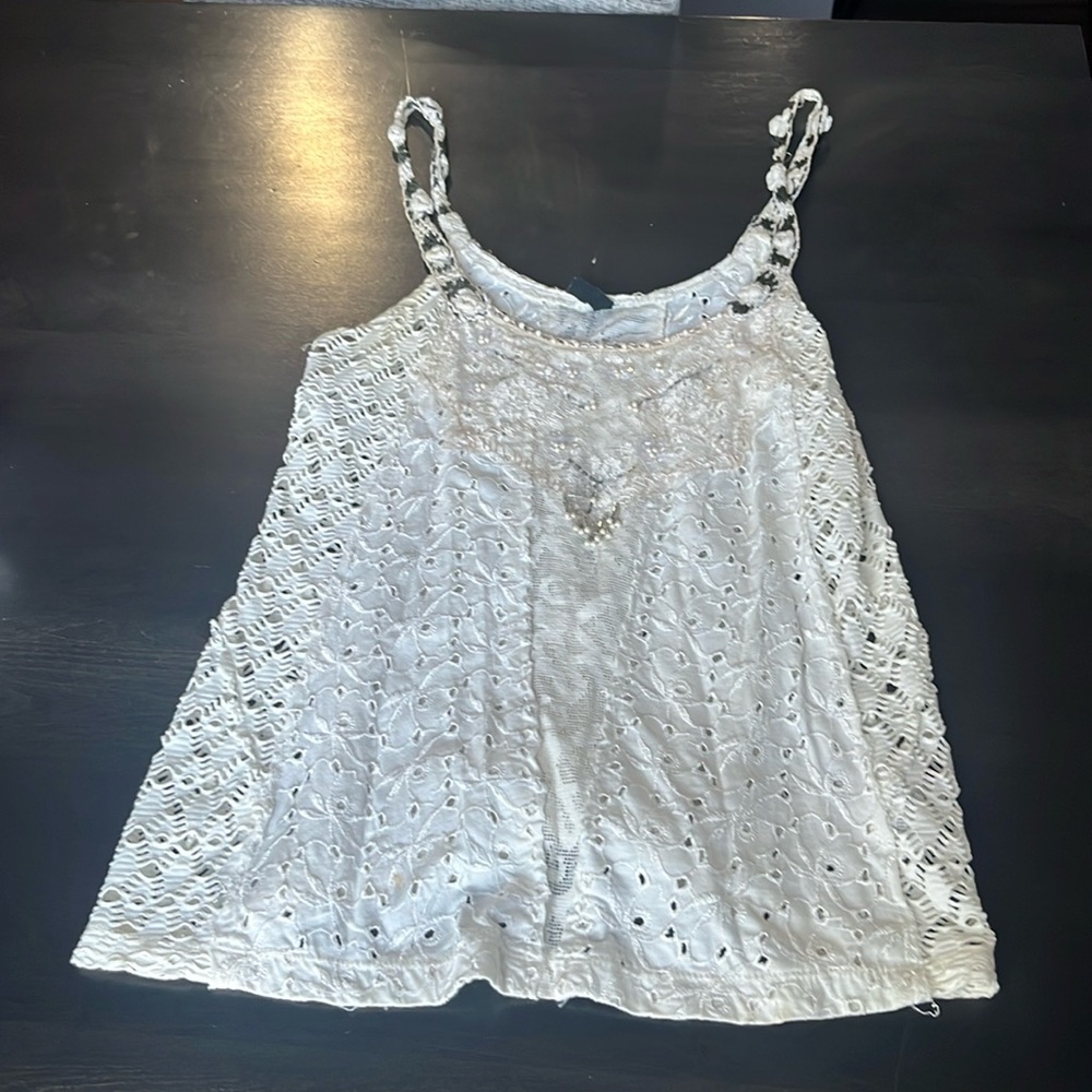Free People spaghetti strap top with jeweled details.